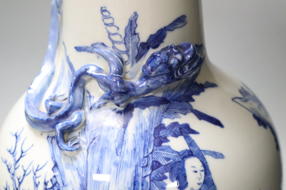 A 19th century Chinese porcelain blue and white vase and stand, neck sprigged with a serpent, on wood plinth, 49cm total height